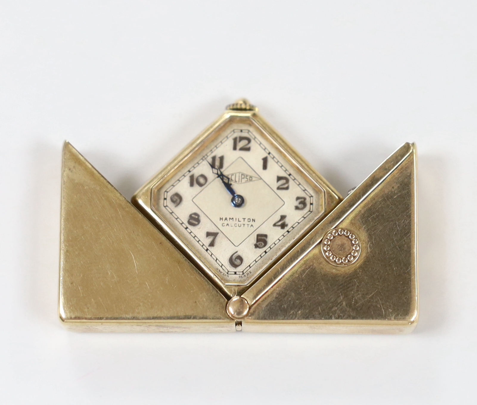 A 1930's/1940's yellow metal Eclipso square cased travelling watch, retailed by Hamilton of Calcutta, 29mm, gross weight 30.9 grams.
